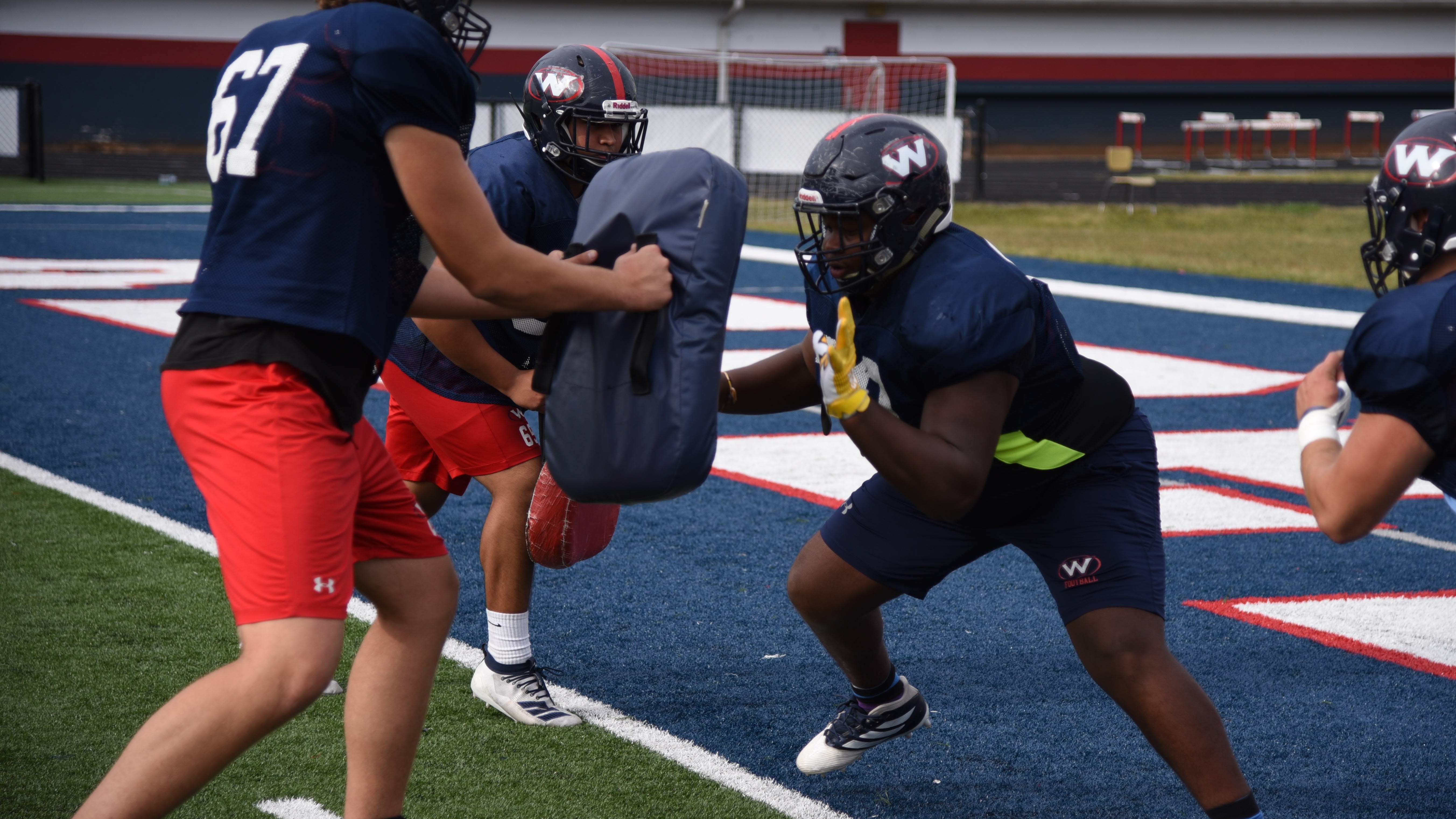 Tyrell Ragland participates in offensive line drills during a practice at West High School on Oct. 15, 2019. 